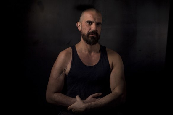 Nik Dimopoulos was injured during his arrest by police at Hares and Hyenas bookstore in May 2019. 