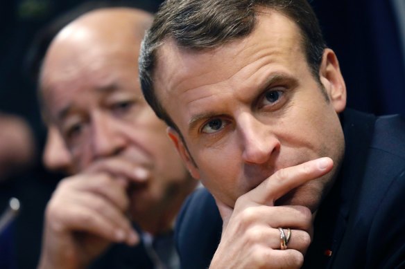 French President Emmanuel Macron, right, and French Foreign Affairs Minister Jean-Yves Le Drian.