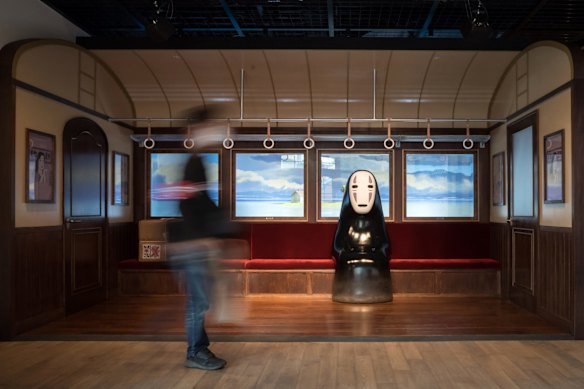 No Face, a character from Spirited Away, greets visitors at Ghibli Park.