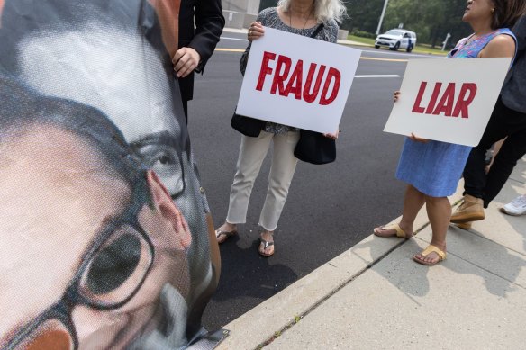 Protesters outside a federal court in New York for a George Santos appearance last week.