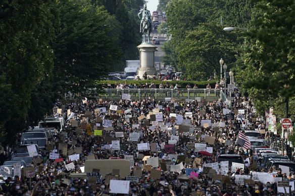 Demonstrators march toward Lafayette Park and the White House to protest against police brutality on Tuesday, June 2.