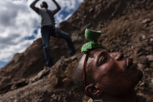 A digger gets ready to go into a mine shaft in Kawama, in the Democratic Republic of Congo.