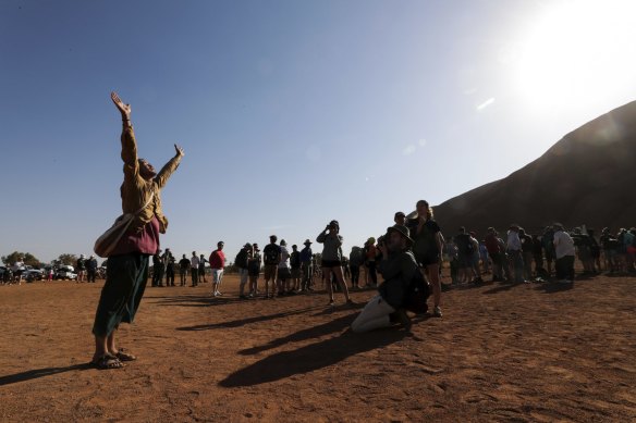 Japanese man Hikaru Ide pays his respect to Uluru and the wishes of the traditional owners and has chosen not to climb.