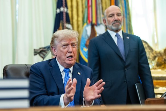 Commerce Secretary Howard Lutnick, right, was reportedly pushing for last-minute changes to the proposed deal.