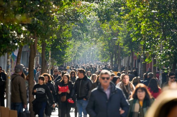 Crowds make their way along the pedestrian shopping area of Fuencarral street in central Madrid, Spain, on Wednesday.