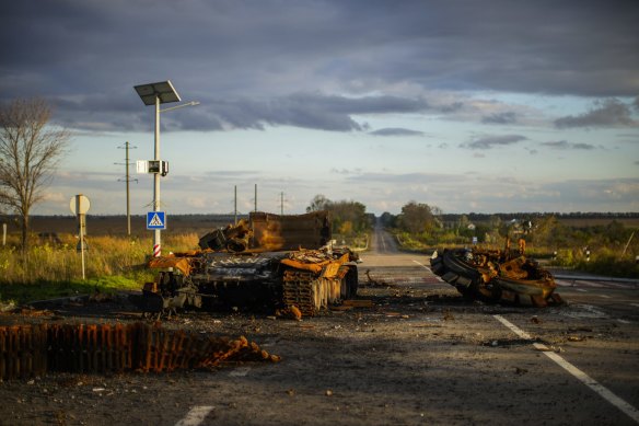 Remains of a destroyed Russian tank are scattered on the ground along the road between Izium and Kharkiv.