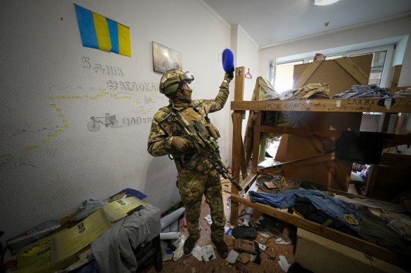 A Russian soldier walks inside the Ukraine’s Azov Regiment base, in a photo taken during a trip organised by the Russian Ministry of Defence.