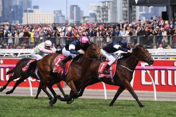 Rekindling and jockey Corey Brown, centre, during their 2017 Melbourne Cup win. 