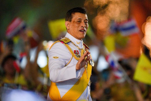Thailand’s King Maha Vajiralongkorn waves to royalist supporters during a ceremony in 2020.