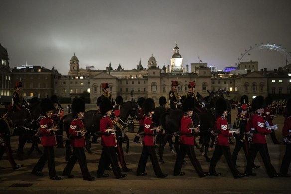 Guards march during a rehearsal for Queen Elizabeth II procession from Buckingham Palace to Westminster Hall.