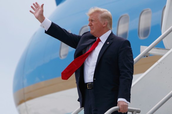 President Donald Trump waves after arriving on Air Force One in Miami in 2017.