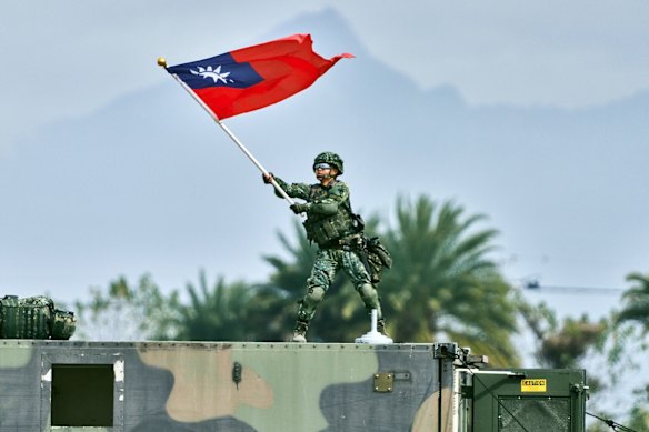 A soldier waves a Taiwanese flag during a military exercise last week.