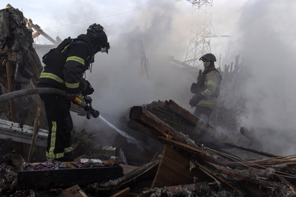 Firefighters at the scene of a Russian air attack in Kostiantynivka, Donetsk region, Ukraine, on Friday. Russia pounded Ukraine after the US decided to pause intelligence sharing that Kyiv used to anticipate and defend attacks.