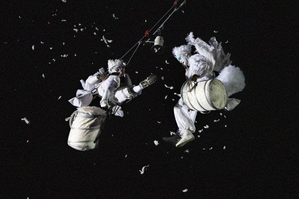 Feathers drop from the sky as Gratte Ciel perform.