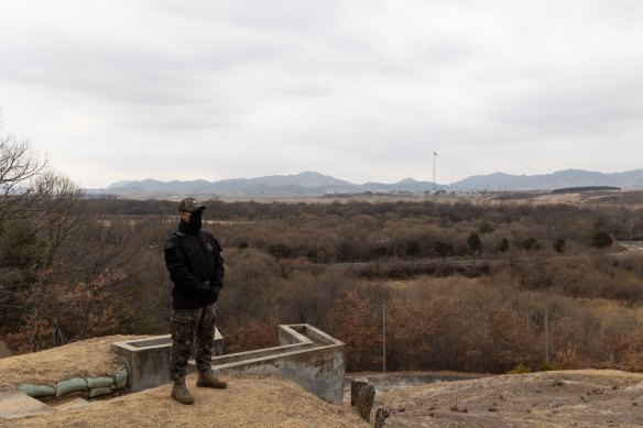 A South Korean soldier stands guard in front of North Korea at the truce village of Panmunjom in the Demilitarised Zone.