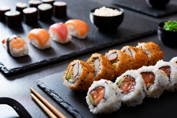 Maki rolls (rear), nigiri sushi and uramaki.