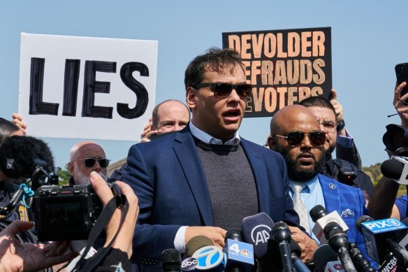 George Santos speaks to the media outside federal court in Central Islip, New York.