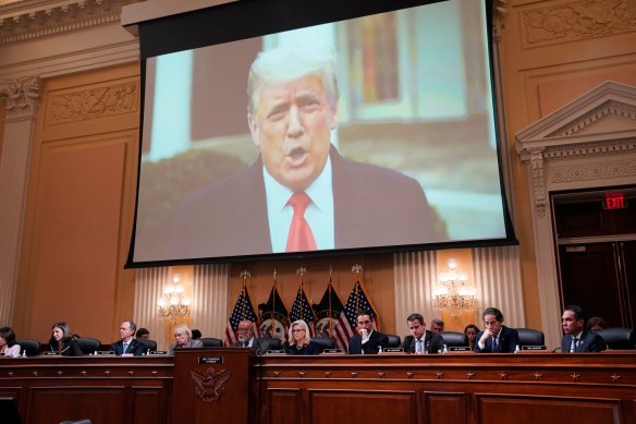 A video of former US president Donald Trump displayed on a screen during the hastily arranged hearing.