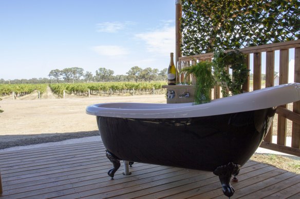 Luxuriate in the outdoor clawfoot bathtub before retiring to the comforts of a luxe safari tent.