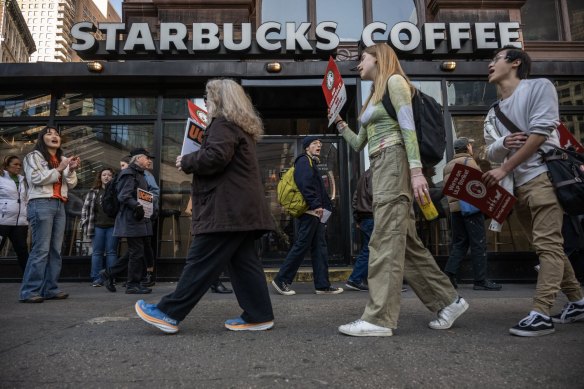 Starbucks workers picket for improved pay and conditions in New York last month.