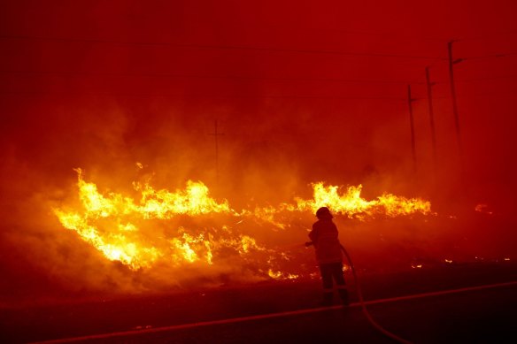 Photographs show spot fires breaking ahead of the Clear Range Fire along the Monaro Highway on February 1.