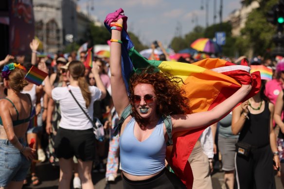 An attendee with a rainbow flag marches during the annual Pride event in Budapest, Hungary, on Saturday.