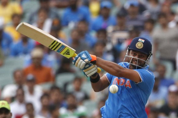 Suresh Raina, pictured at the 2015 World Cup, believe Indian players should be allowed to compete outside of the IPL. 