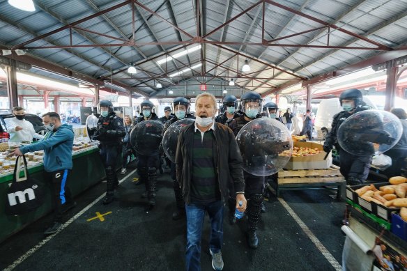 Dozens of police descended on Queen Victoria market after anti-lockdown protesters marched through the iconic site as part of a 'Freedom Day' protest.

