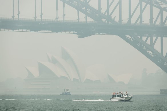 The thick smoke obscures Sydney's Opera House and Harbour Bridge.