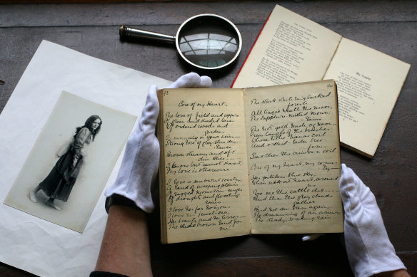 The manuscript of Dorothea Mackellar's 'Core of my Heart' (AKA 'My Country') held by specialist librarian, Margot Riley, at the State Library of NSW on August 30, 2006