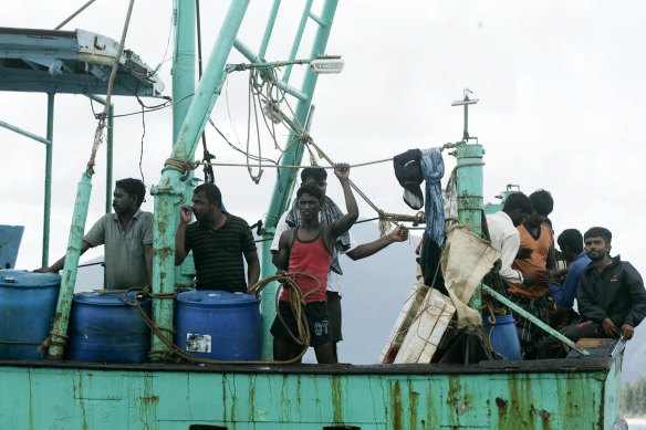 An Australia-bound boat of Sri Lanka refugees waits for help after drifiting into Indonesian waters.