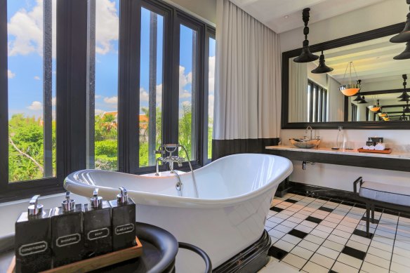 The bathroom in the Siam Suites features a free-standing bath.