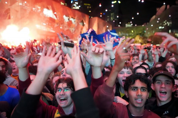 Australian fans celebrate during the Socceroos’ win over Denmark.