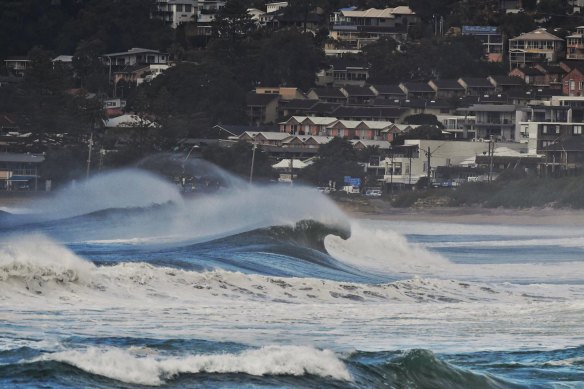 Heavy surf stirred up by an east coast low off the NSW coast in July 2020. The more damaging type of such events is on the increase in a warming world, IAG says.