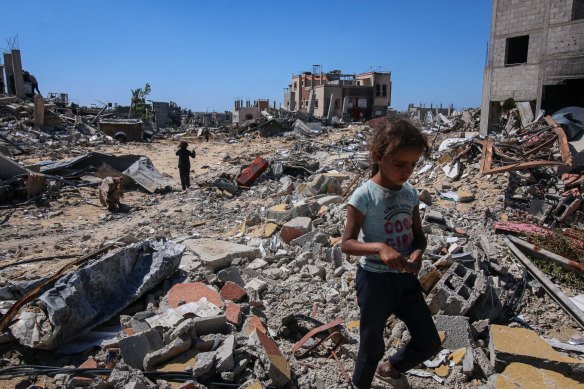 Displaced Palestinians inspect their destroyed homes after fleeing from Rafah, in Gaza this week.