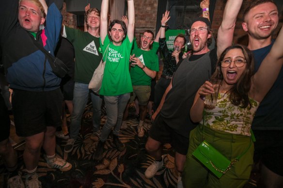Green supporters celebrate on the night of the 2022 Victorian election.
