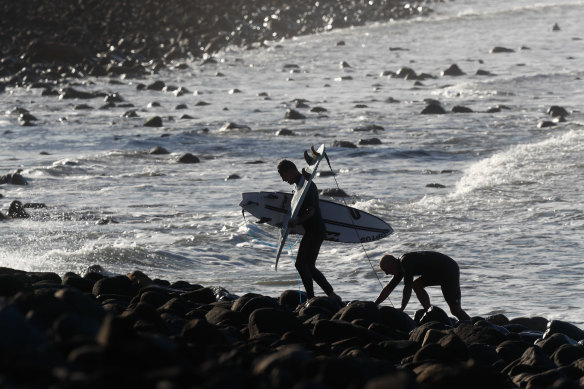 Formston navigating the boulders at Lennox Point surf break.