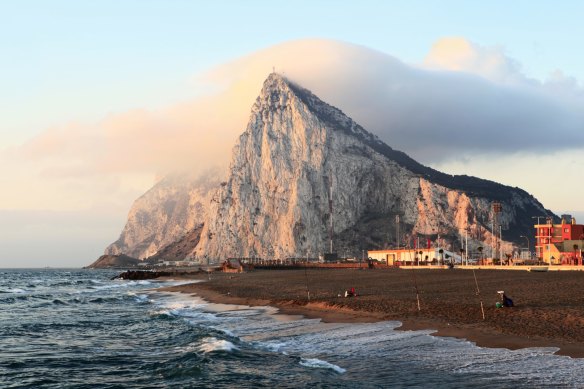 The rock of Gibraltar at sunrise as seen from the coast of Southern Spain.