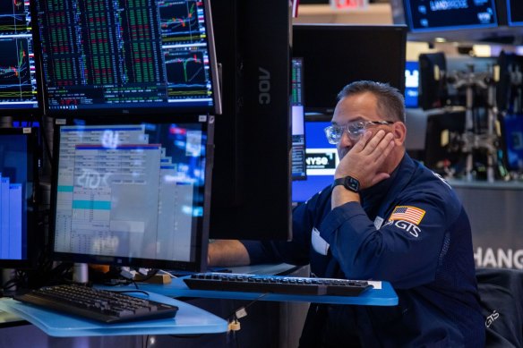 A trader works on the floor of the New York Stock Exchange.