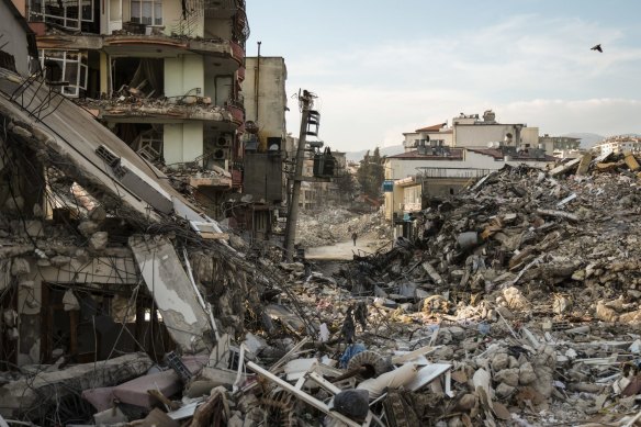 Collapsed buildings block the streets on in Samandag, Turkey after the magnitude 7.8 earthquake hit near Gaziantep on February 6.