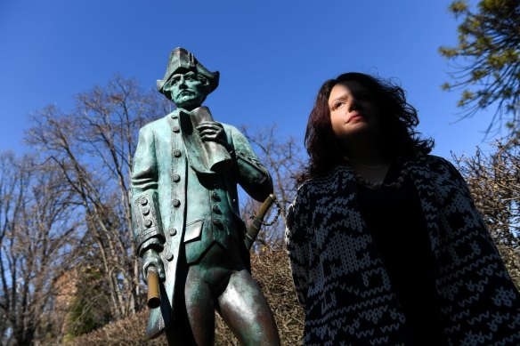 Genevieve Grieves next to the Captain James Cook statue at Cook's Cottage in Fitzroy Gardens.