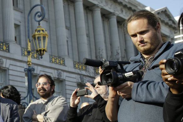 David DePape, right, records a nude wedding in 2013. 