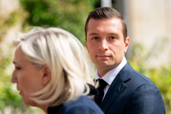 Jordan Bardella, president of National Rally, and Marine Le Pen, who leads the party in parliament.