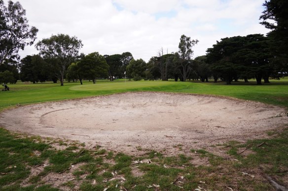 Rakes have been removed from bunkers at this bayside golf course.