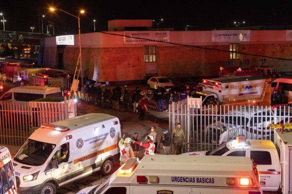 Emergency workers at the scene of the fire in Ciudad Juarez, Mexico.