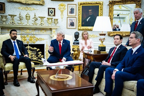 President Donald Trump with the Prime Minister of Iraq, Ali al-Zaidi, in the Oval Office on Tuesday (US time).