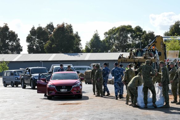 Sand bagging at the Shepparton Showground on Saturday.