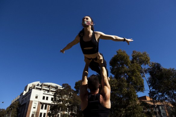 Acrobats Woody Fox and Amber Kaldor train at Harmony Park in Surry Hills. 