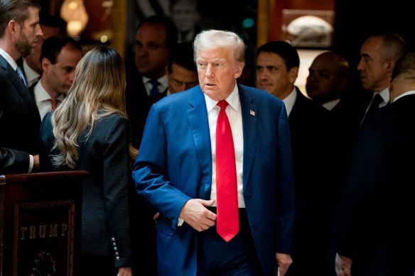 Former US president Donald Trump arrives for a news conference at Trump Tower in New York on Friday.