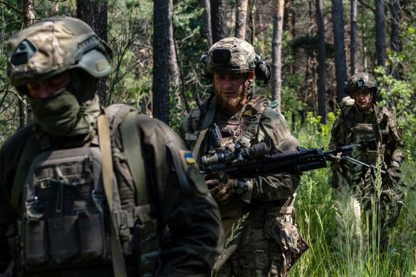 Members of Ukraine’s Bureviy National Guard Brigade during a training exercise in a woodland area near Kyiv.
